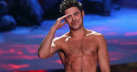 Zac Efron stood on the MTV Movie Awards stage, shirtless, with black dress slacks, looking all kinds of hot.