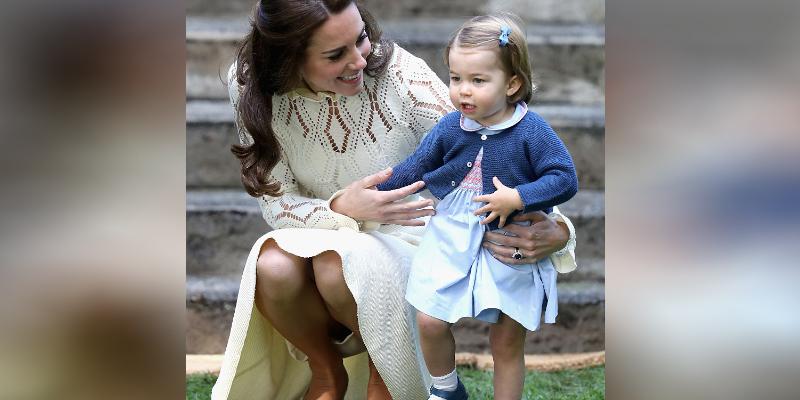 Kate Middleton squats down to help her daughter Princess Charlotte walk at a children's party for Military families during the Royal Tour of Canada on September 29, 2016