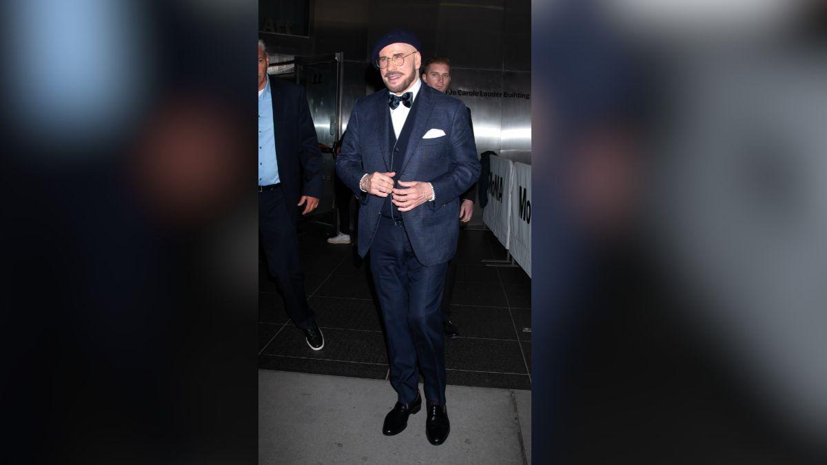 image of John Travolta recently spotted a new look on different red carpets. 