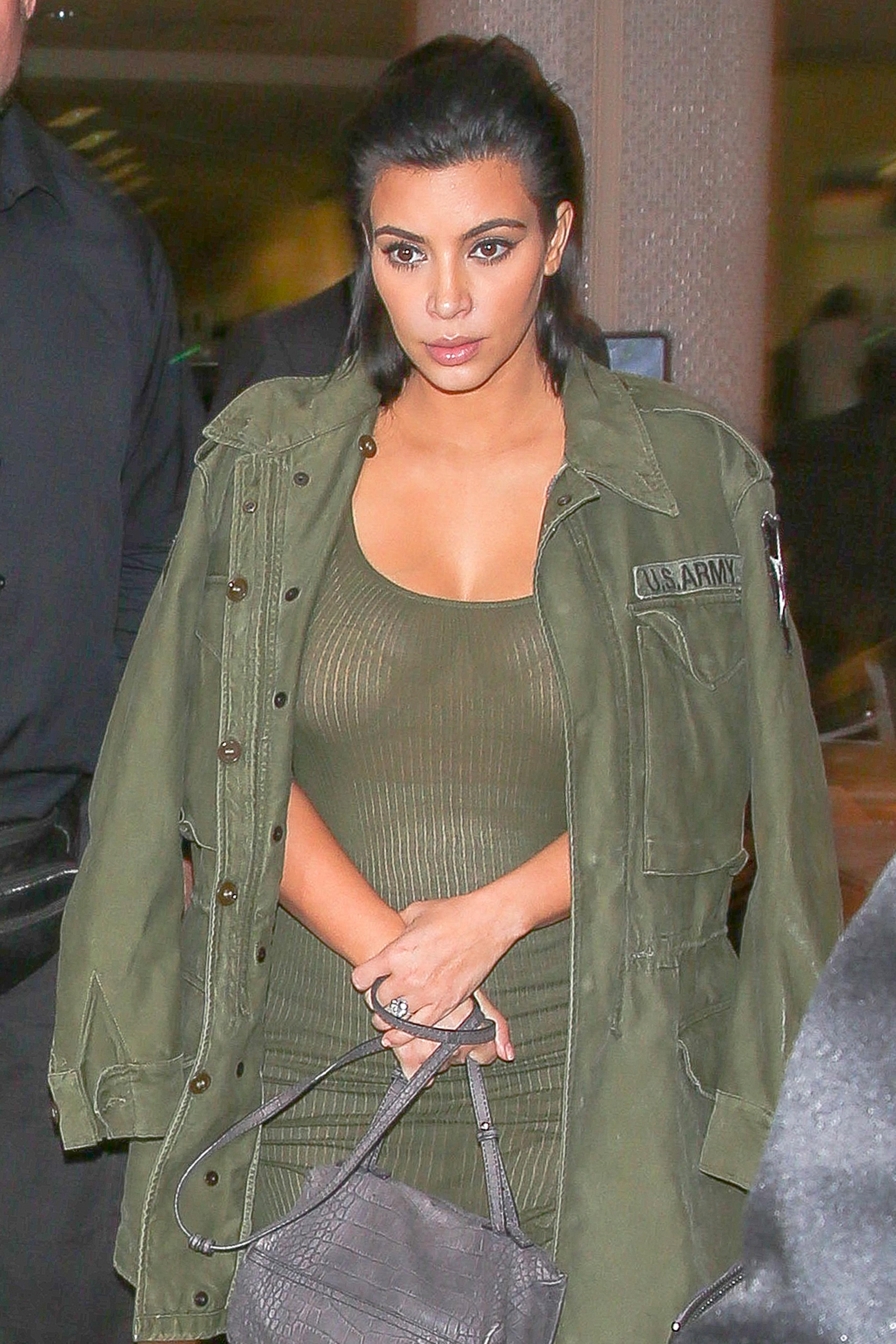 Kim Kardashian is a baby bump beauty arriving at LAX