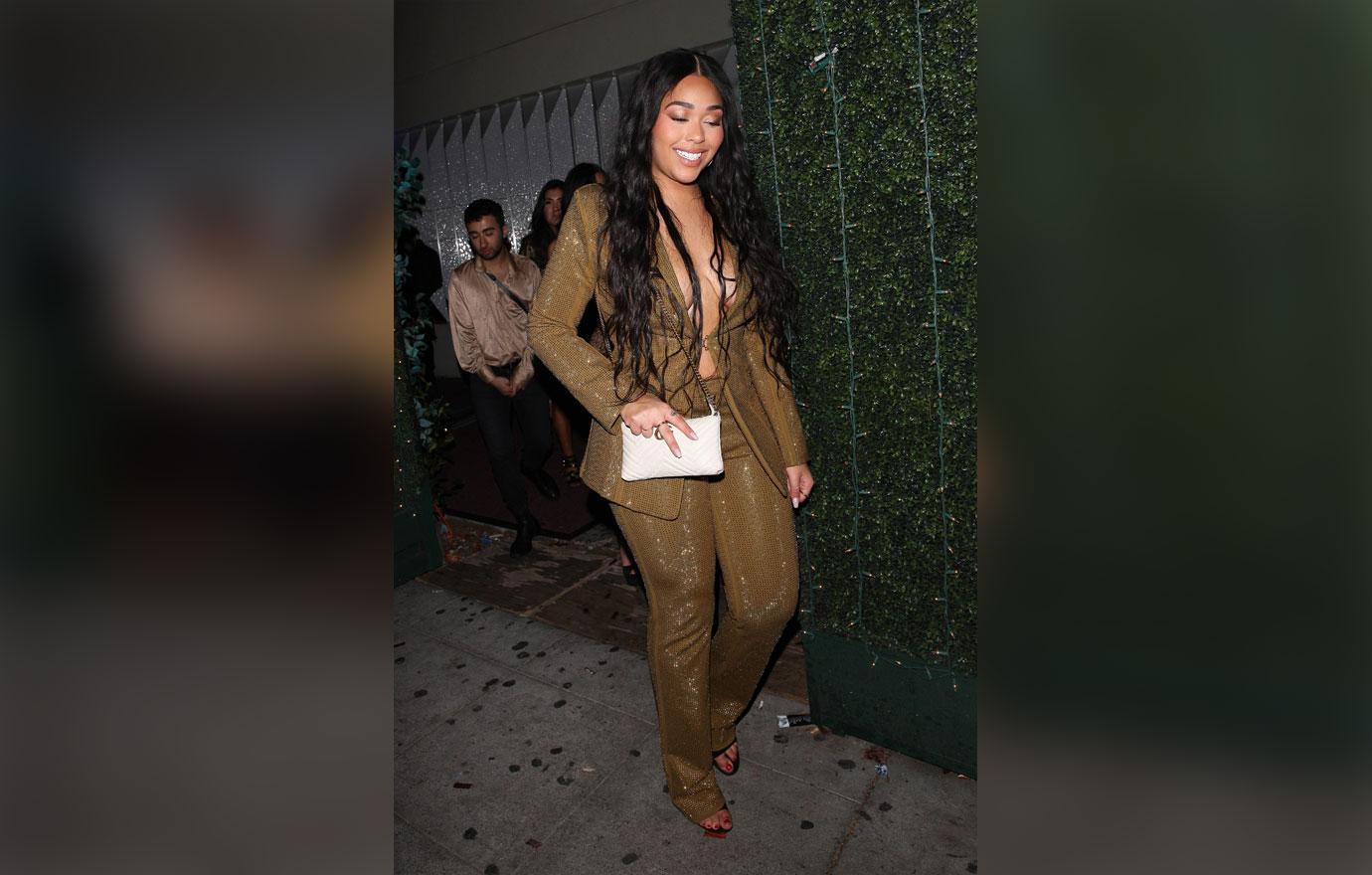 Jordyn Woods wears a shimmering outfit as she leaves the Delilah restaurant after celebrate the New Year