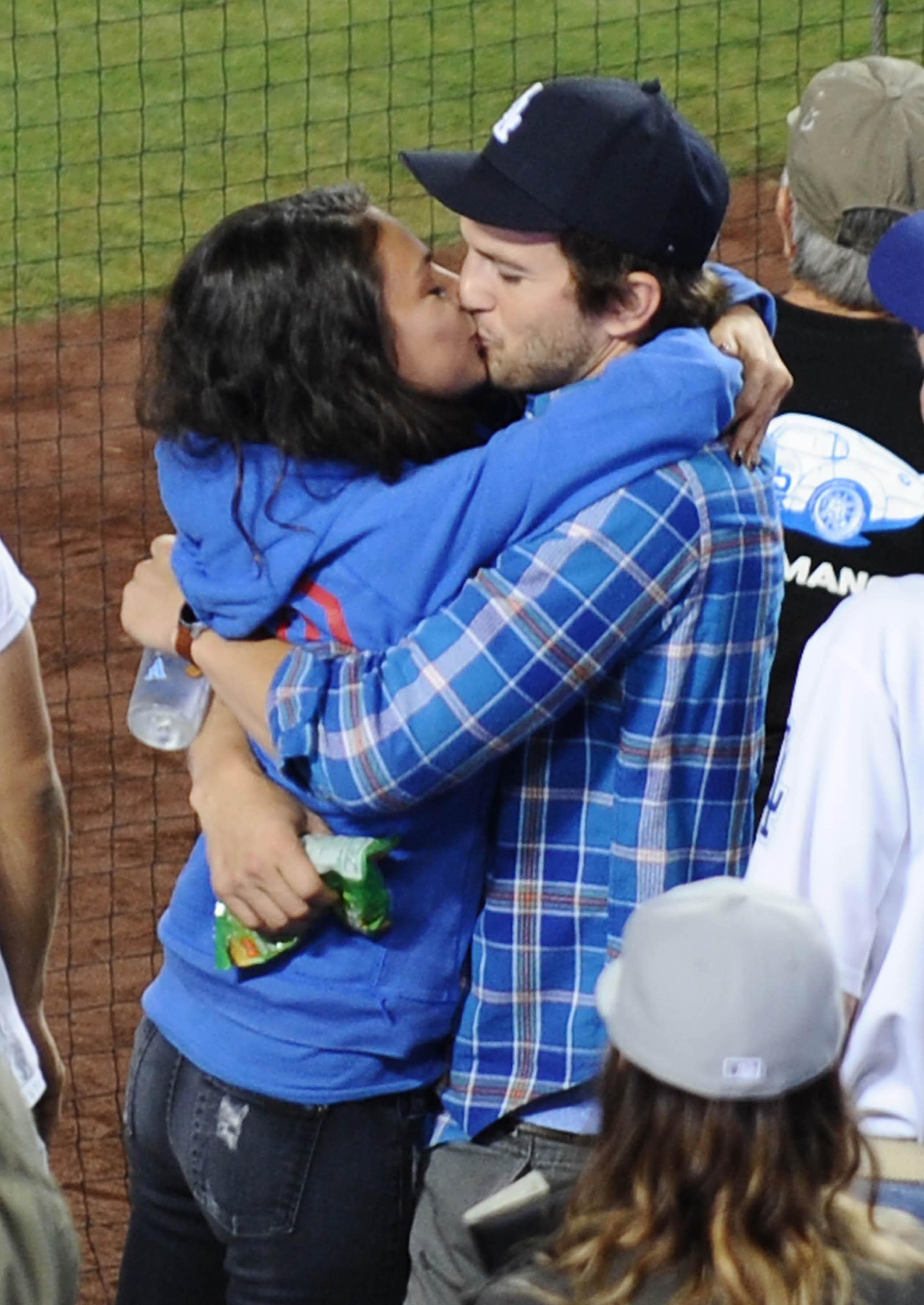 EXCLUSIVE: **PREMIUM EXCLUSIVE RATES APPLY** STRICTLY NO WEB UNTIL 130PM PST SEPTEMBER 3rd 2015**  Mila Kunis and Ashton Kutcher kiss while celebrating a home run at Dodgers baseball game