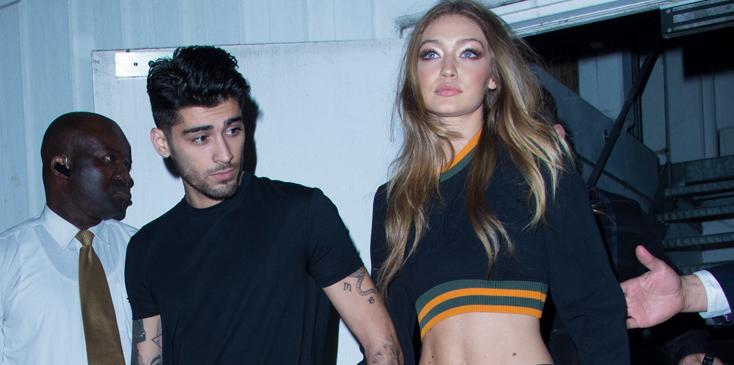 Gigi Hadid and Zayn Malik hold hands while leaving Versus Versace show in London