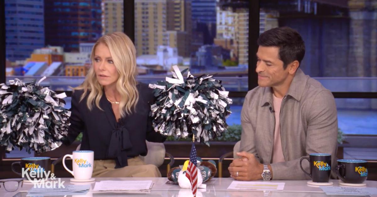 Image of Kelly Ripa held pom poms with her during the show's opening segment.
