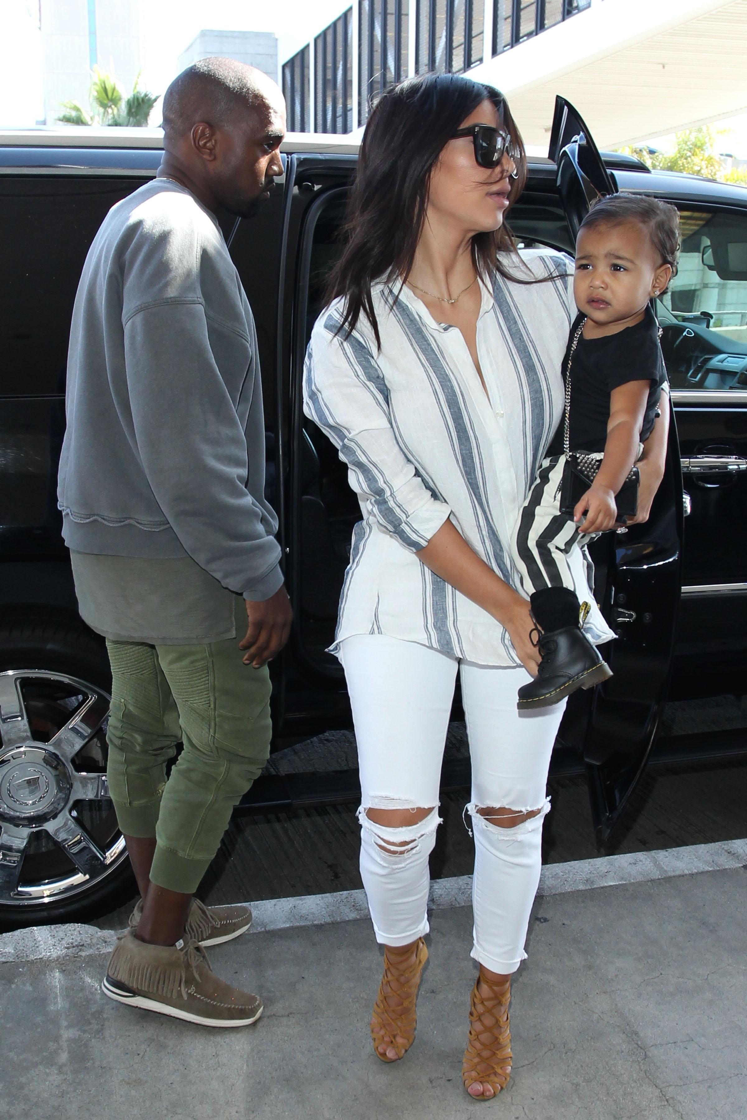 Kim Kardashian and Kanye West depart LA with daughter North