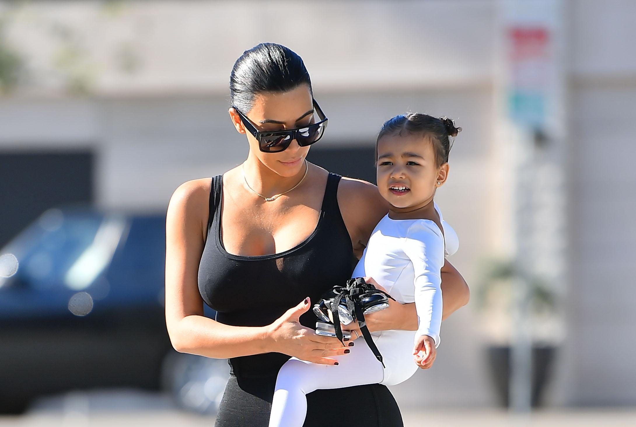 Kim Kardashian is back to black hair as she takes her little ballerina to a dance class