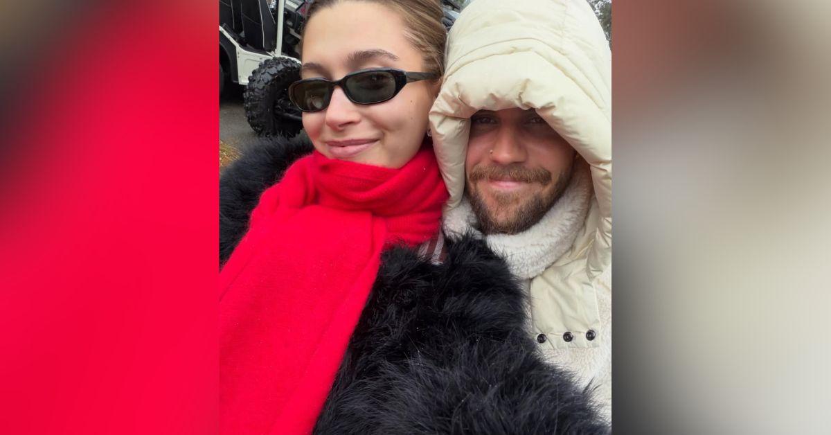 Image of Hailey and Justin Bieber cozied up in coats on Christmas.