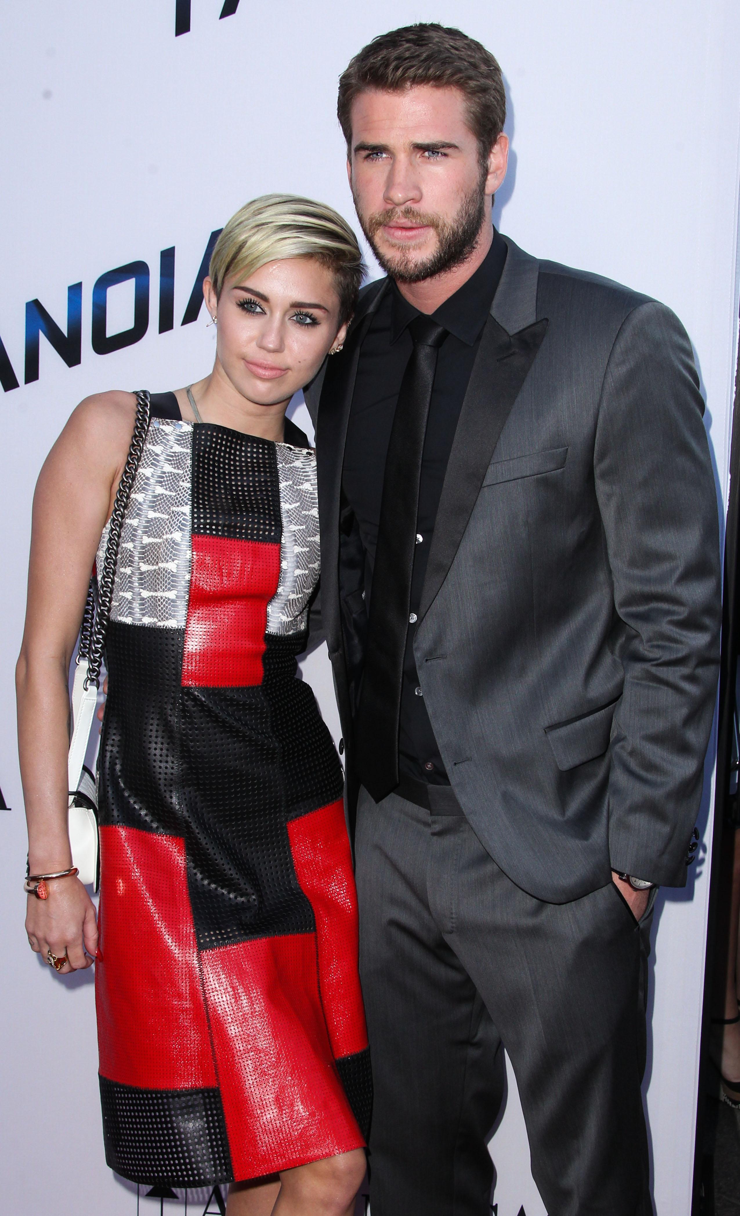 Miley Cyrus and Liam Hemsworth arrive at the Los Angeles premiere of &#039;Paranoia&#039;