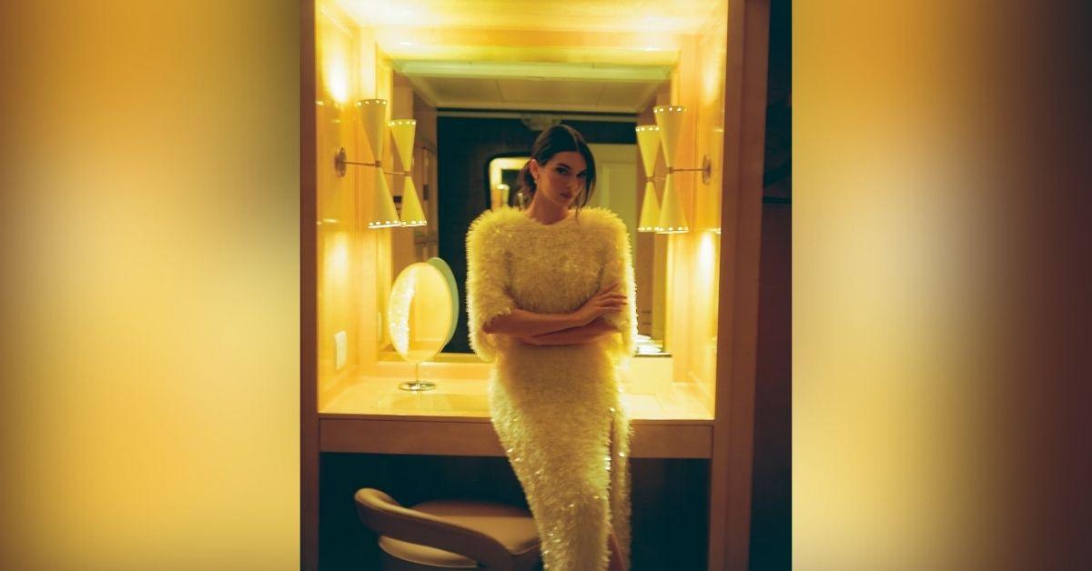 image of Kendall Jenner wore a fuzzy white gown with a thigh-high slit at the L'Oréal gala.