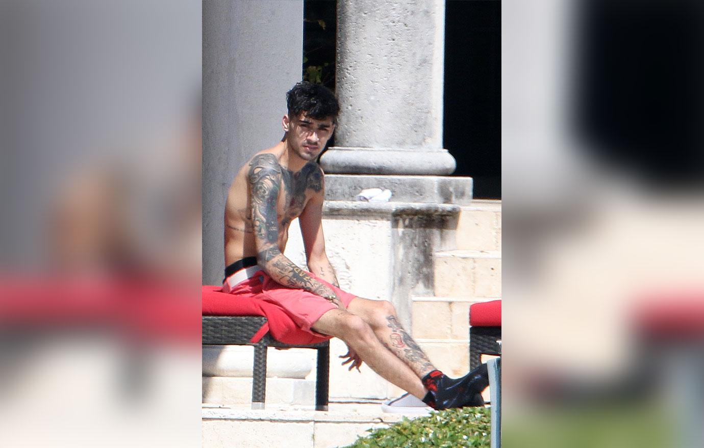 Zayn Malik relaxes by the pool at his home in Miami