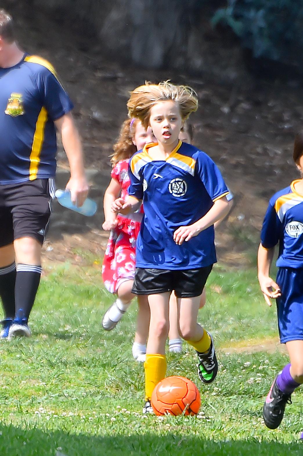 Shiloh and Zahara Jolie Pitt are accompanied by a bodygaurd to their Soccer Game in Studio City