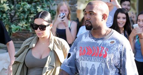 Pregnant Kim Kardashian and Kanye West get mobbed by fans as they leave the cinema in west lake