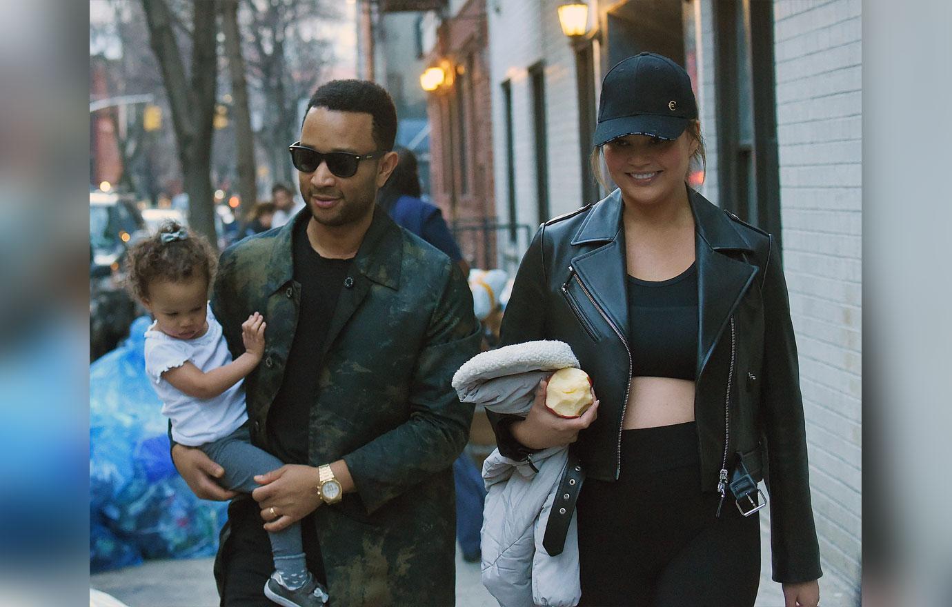 Chrissy Teigen, John Legend and baby Luna have fun on a playground in SoHo