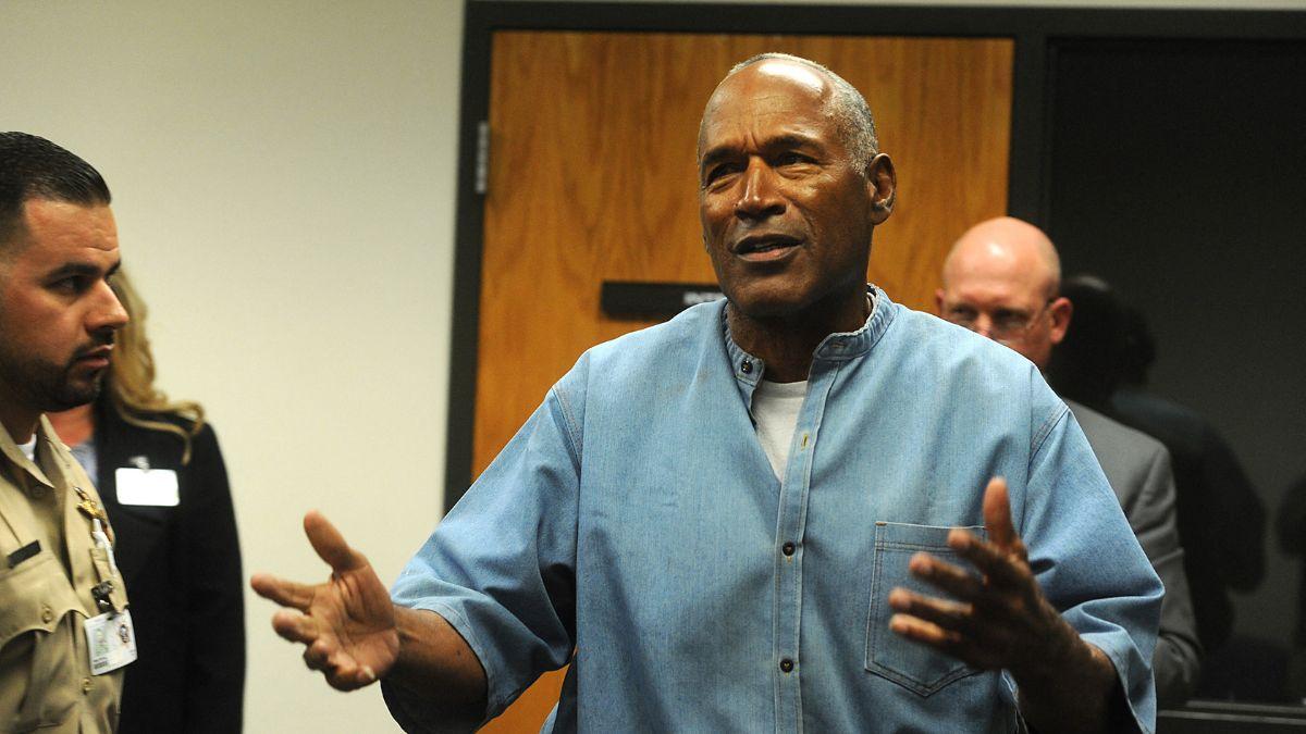 Photo of O.J. Simpson's legal team claimed Mark Fuhrman planted the glove out of racism.