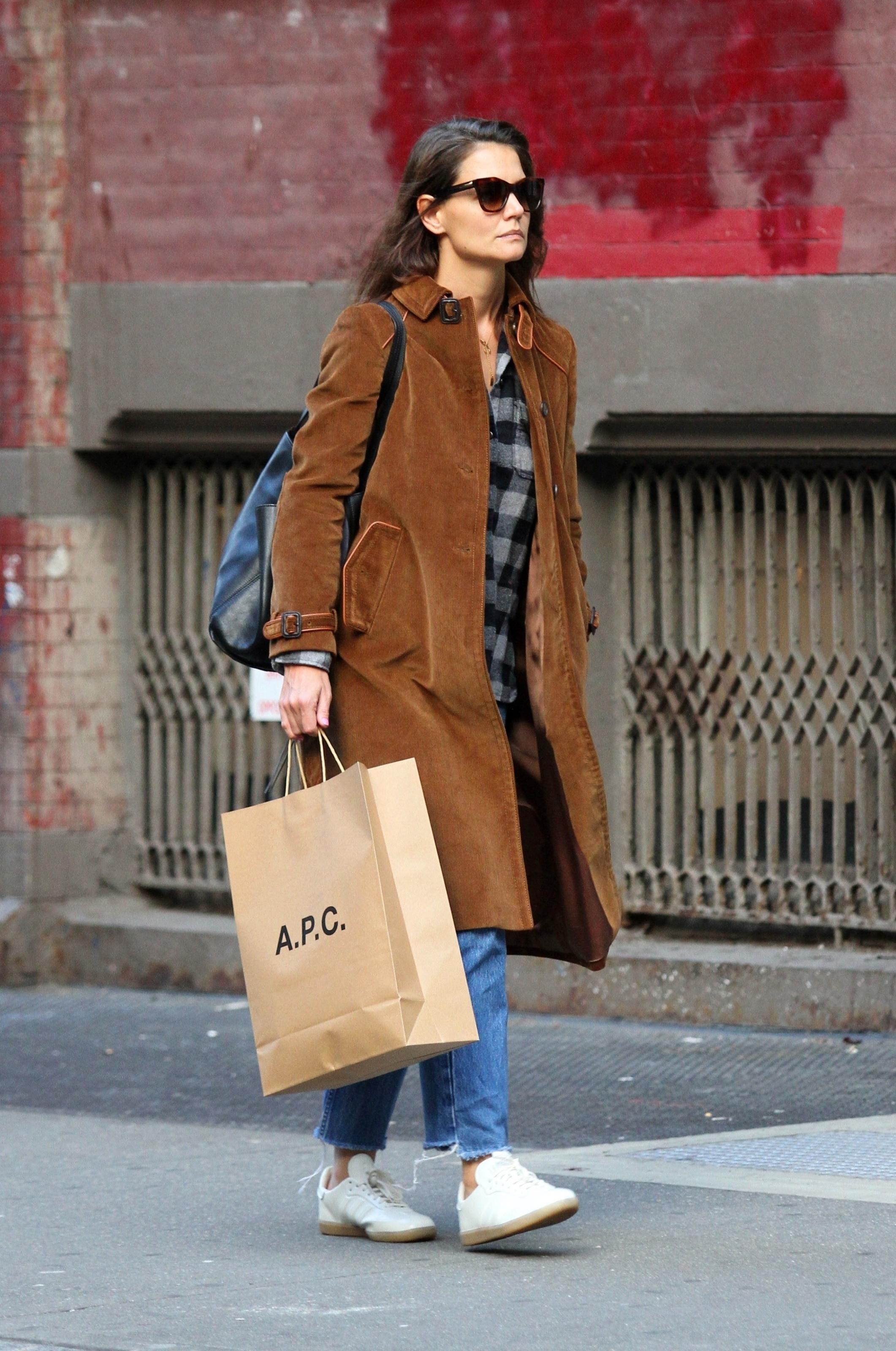 Katie Holmes rides a crowded subway train in NYC