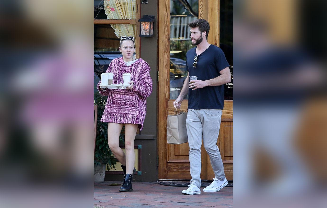 *EXCLUSIVE* Miley Cyrus and Liam Hemsworth make a coffee stop wearing wedding rings