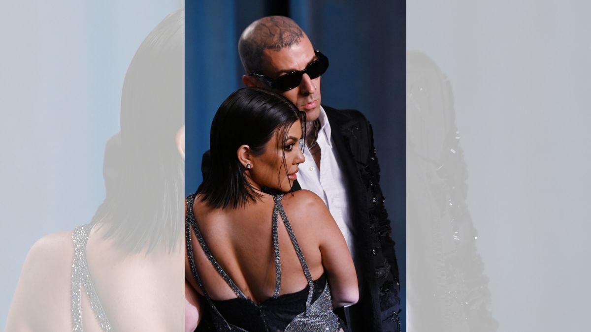Image of Travis Barker left the stage to embrace Kourtney after spotting the surprise pregnancy announcement in the crowd.