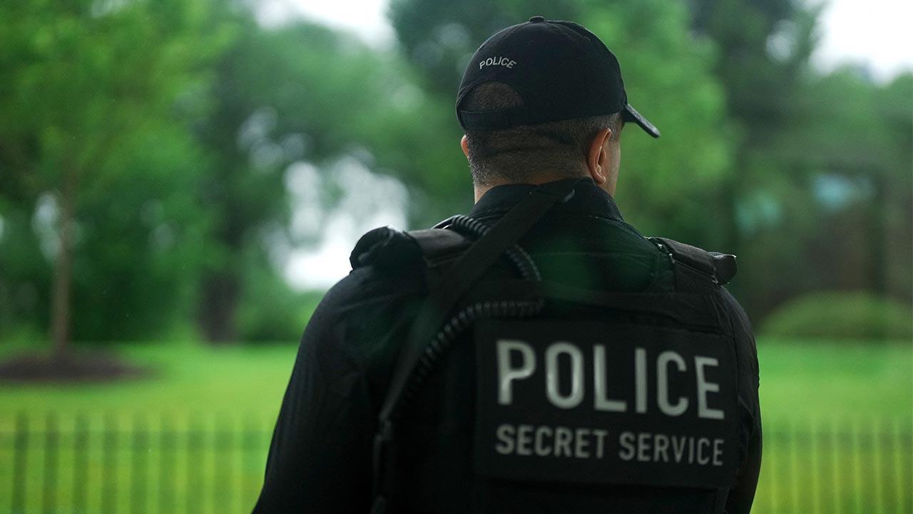Image of Secret Service agents investigated the alleged threats following a Crime Stoppers tip.