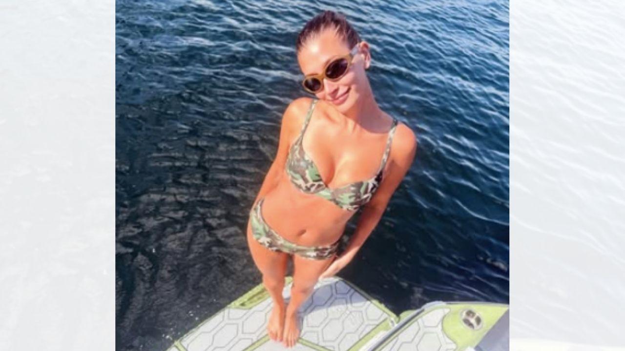 Image of Hailey Bieber put her cleavage on display in the summertime snap. 