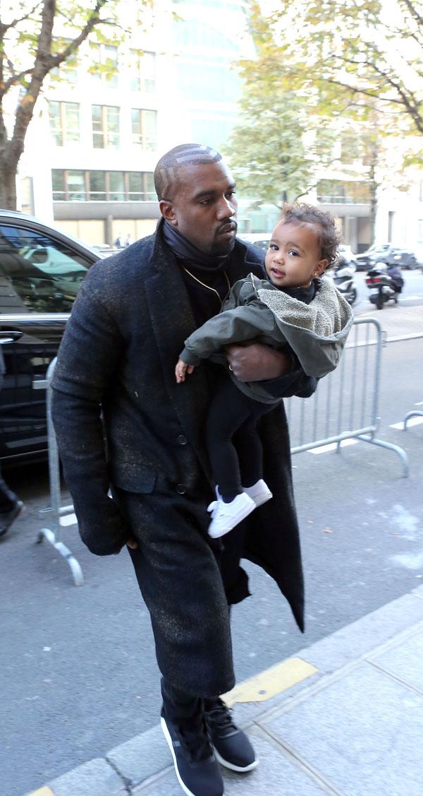 Kanye West, Kim Kardashian and baby North arrive at their apartment in Paris