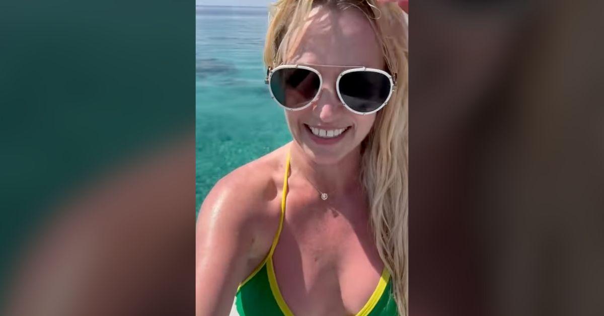 Image of Britney Spears stunned in a color-blocked swimsuit.