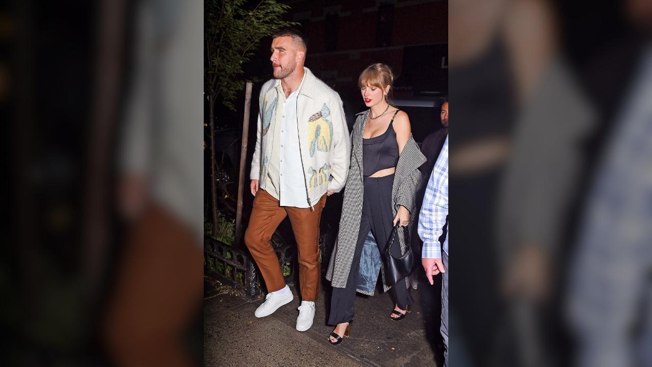 Taylor Swift and Travis Kelce holding hands in NYC.