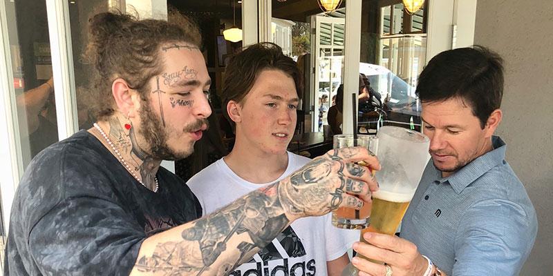 Mark Wahlberg Toasts A Beer With Post Malone.