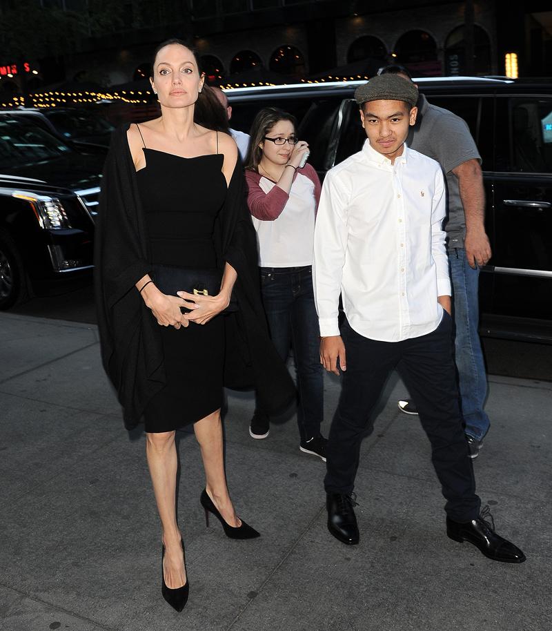 Angelina Jolie looks stunning baring her shoulders in a black gown as she goes out with her son Maddox Jolie Pitt in NYC