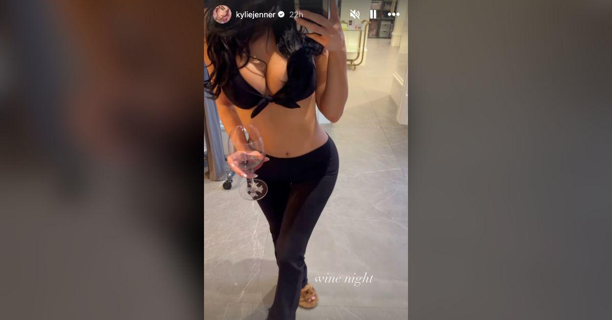 Image of Kylie Jenner popped out of a barely-there bra top.