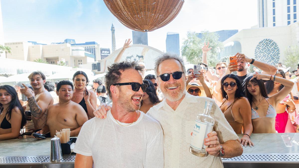breaking bad reunion bryan cranston aaron paul get behind the bar and the dj booth for wild tequila bash in vegas