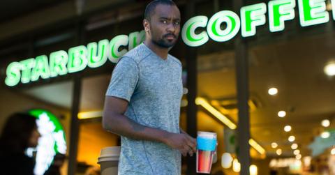 Nick gordon looks confused being served papers lawsuit starbucks