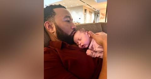 chrissy teigen john legend cuddling newborn daughter esti
