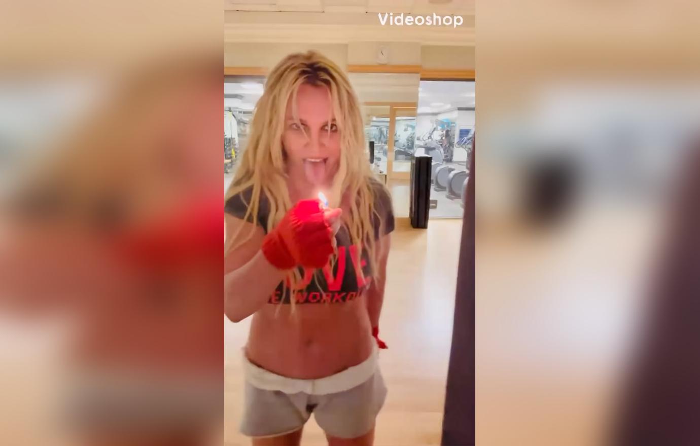 britney spears holds lighter tongue weirdly dancing hips dont lie