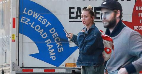 miley cyrus liam hemsworth moving in