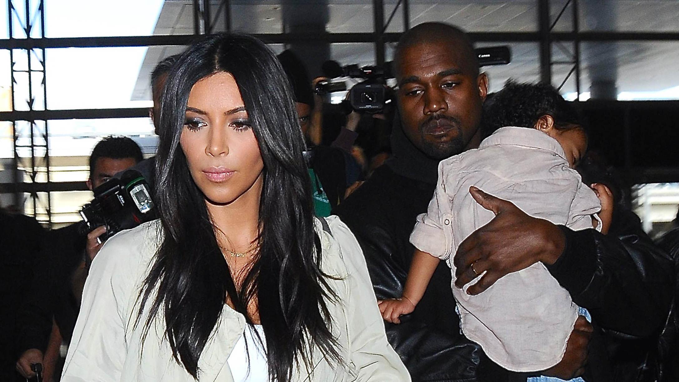 Kim Kardashian &amp; Kanye West Catch A Flight With North