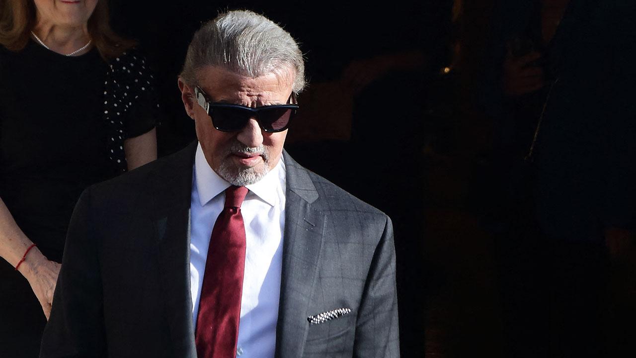 Image of Sylvester Stallone admitted to showering with his clothes on. 