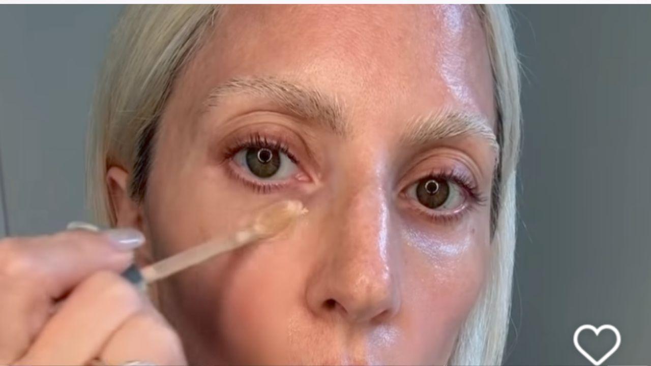 Image of Gaga applying makeup.
