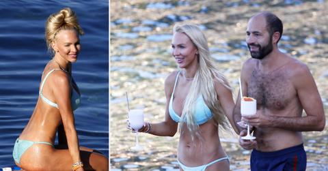 christine quinn practicing yoga on a board