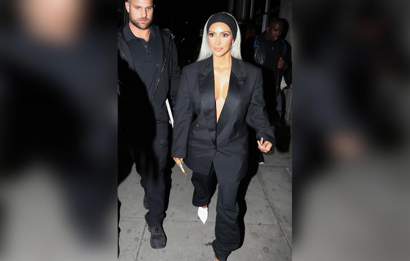 Kim Kardashian exits the Create &amp; Cultivate Conference in a plunging suit