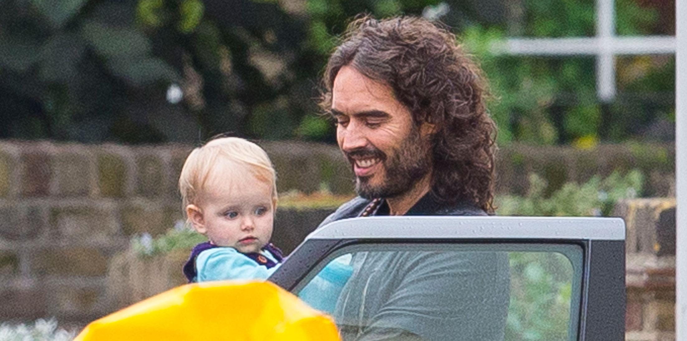 Russell Brand Cradles Precious Daughter During Stroll With Wife