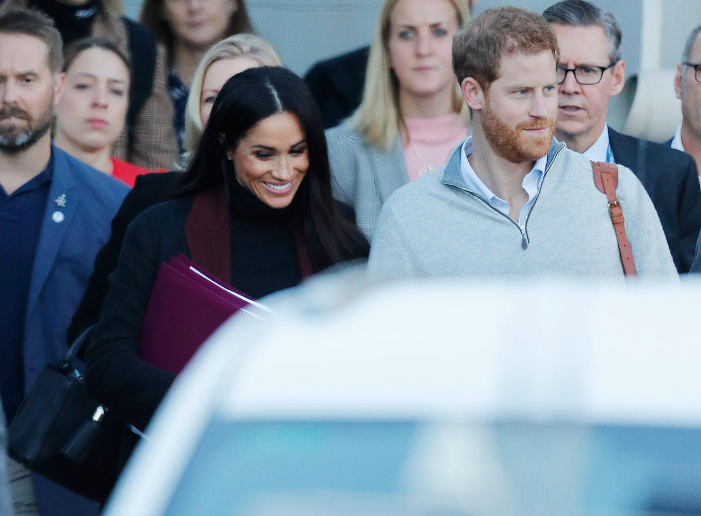 Prince Harry and his wife Meghan Markle pictured arriving in Sydney.