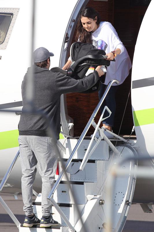 EXCLUSIVE: Ashton Kutcher and Mila Kunis were seen departing on private jet from Hawaii.