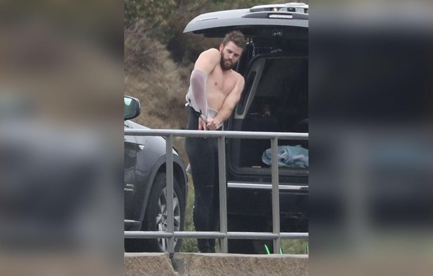 *EXCLUSIVE* Liam Hemsworth strips off after surfing in Malibu