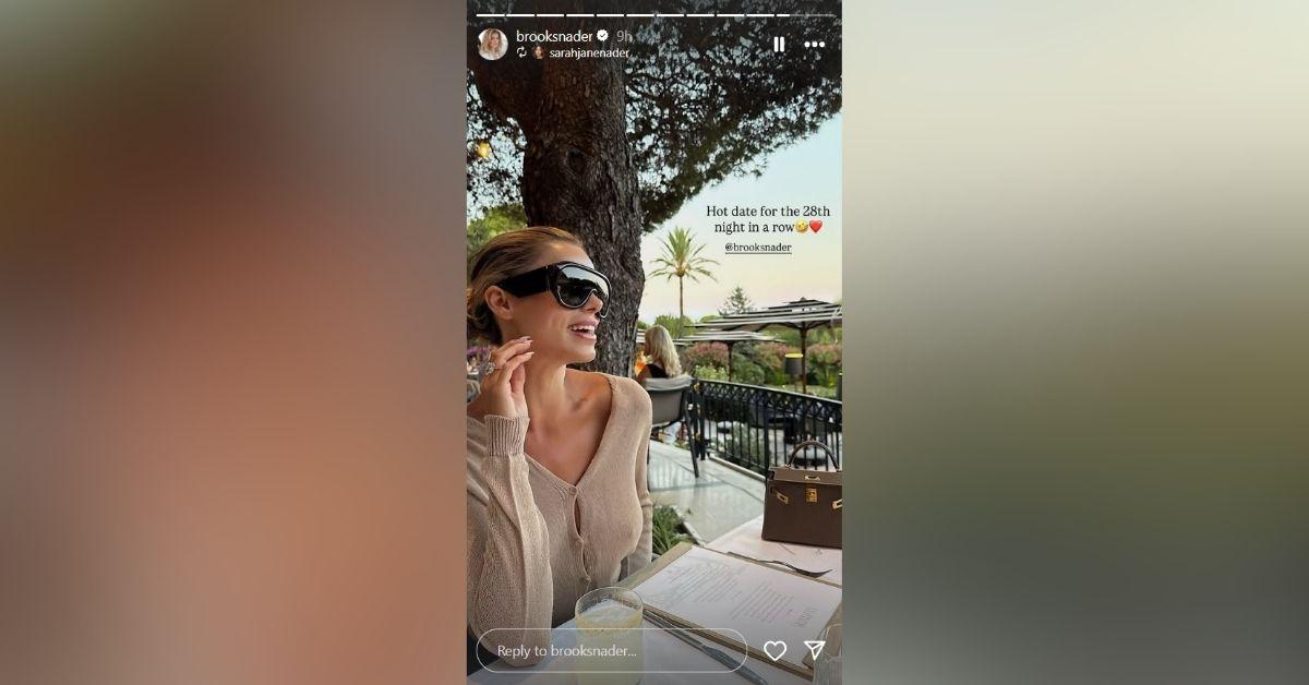 image of Brooks Nader wore a loose sweater with no bra during dinner.