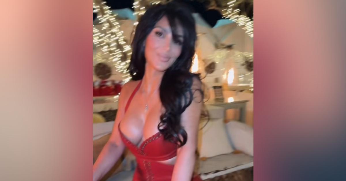 kim kardashian nearly spills out red gown photos