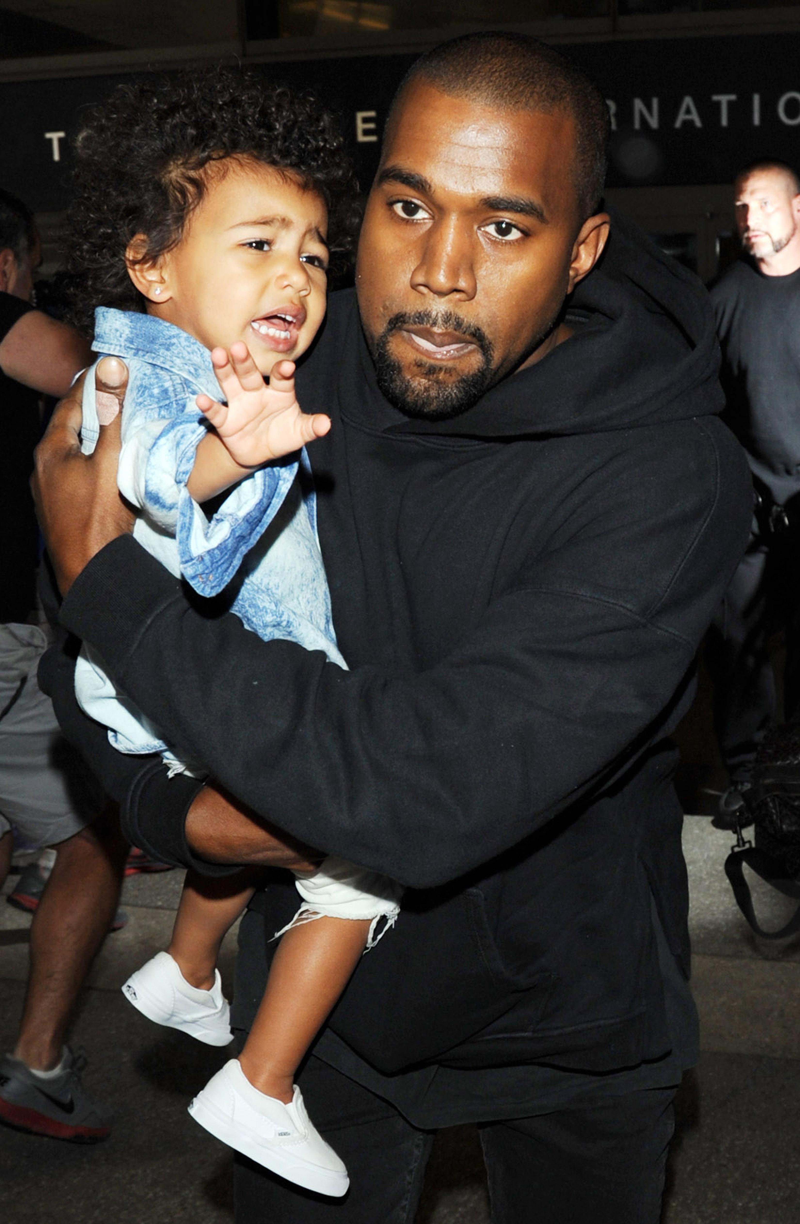 Kanye West served papers at LAX with Kim Kardashian and daughter North West