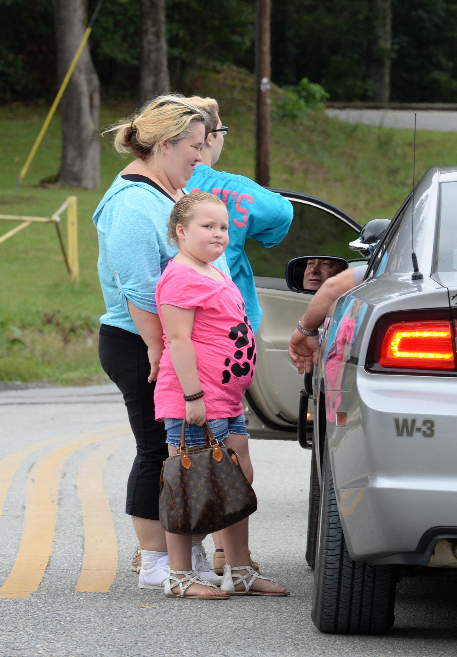 Honey Boo Boo shows off her new Louis Vuitton bag in McIntyre, GA