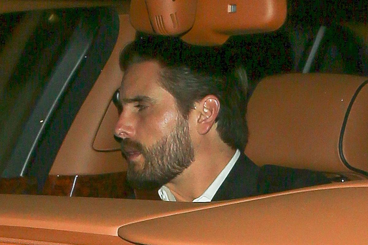 Scott Disick is camera shy at Rihanna&#8217;s Grammy Awards Party at 1 OAK