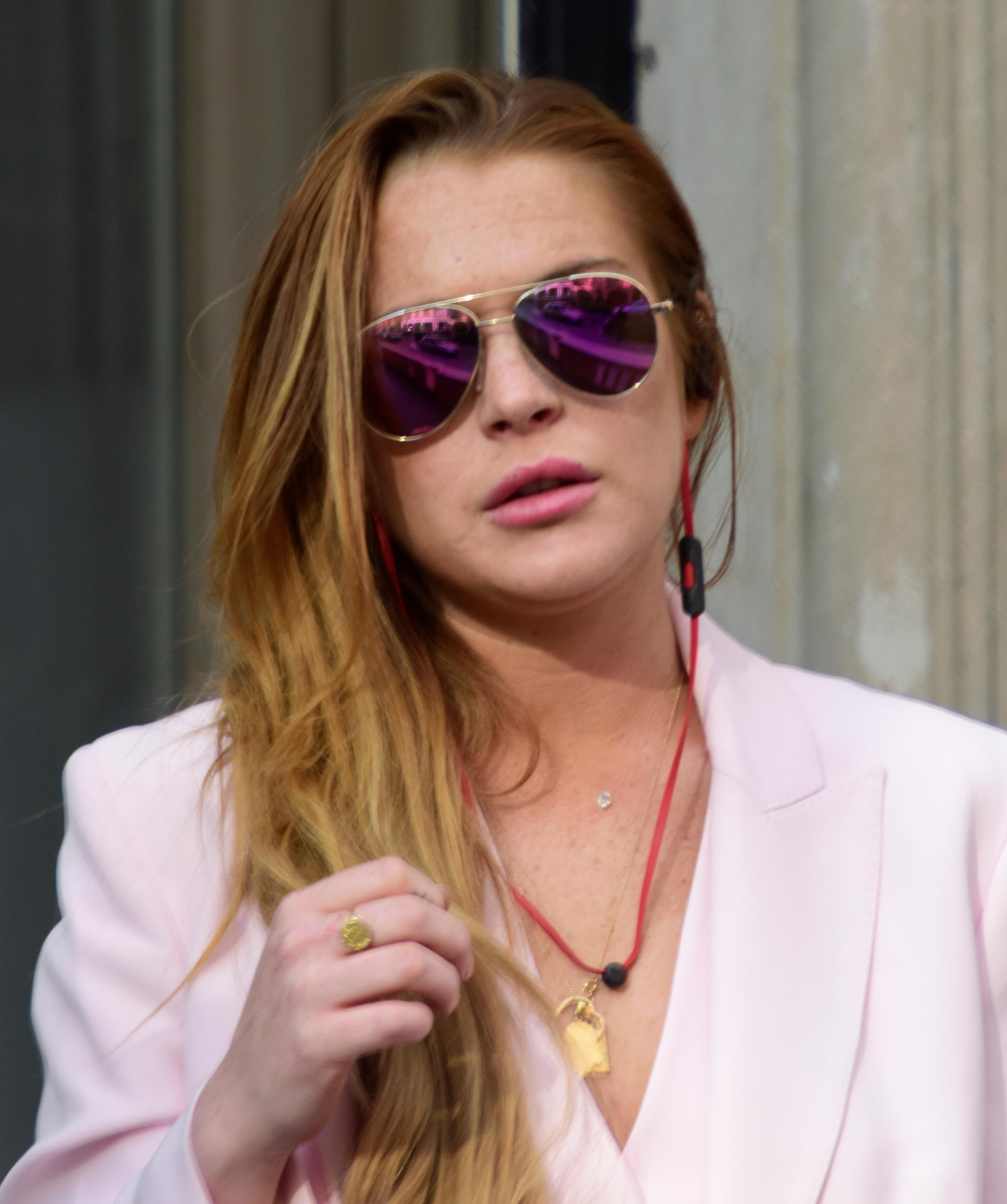 Lindsay Lohan seen outside smoking and talking on the phone in London, UK.