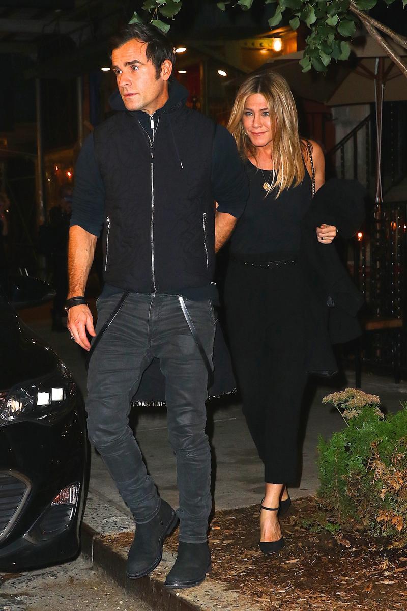 Justin Theroux and Jennifer Aniston hold hands as they head out after dinner